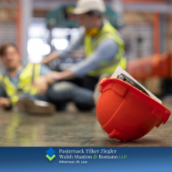 An injured worker in Oyster Bay loses their helmet while falling to the ground